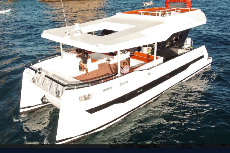 60-foot event catamaran with an open upper deck, seen from above