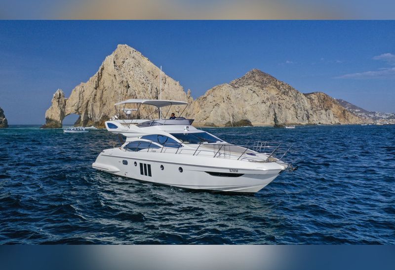 50-foot Azimut flybridge yacht near the rock formations of Land's End