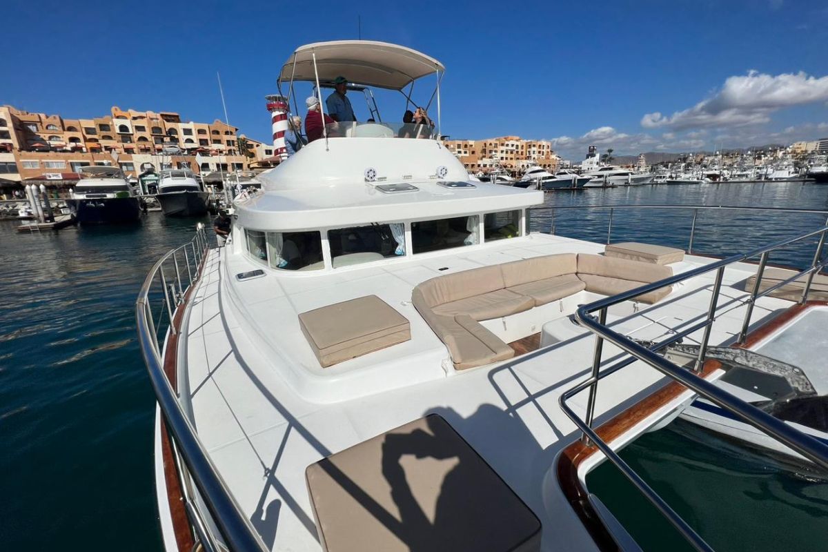 Power catamaran moored in a marina below the hills of Baja California Sur