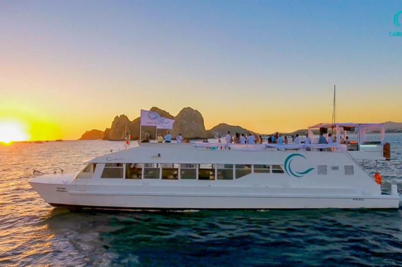 Large event catamaran at sunset off Land's End